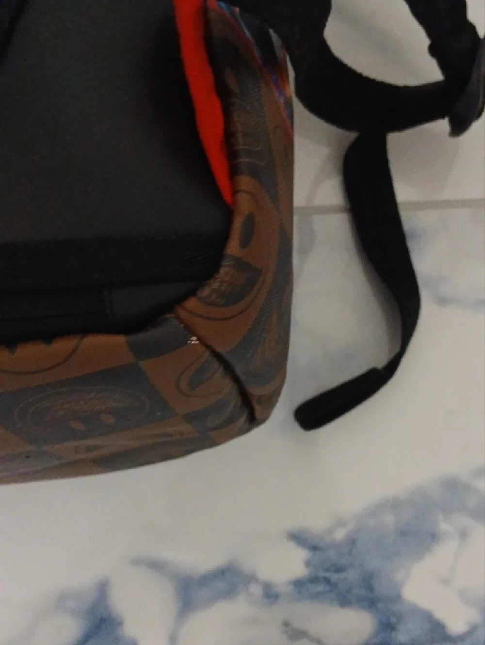 Sprayground Brown Checkerboard Backpack with Multicolor Sticker Graphics